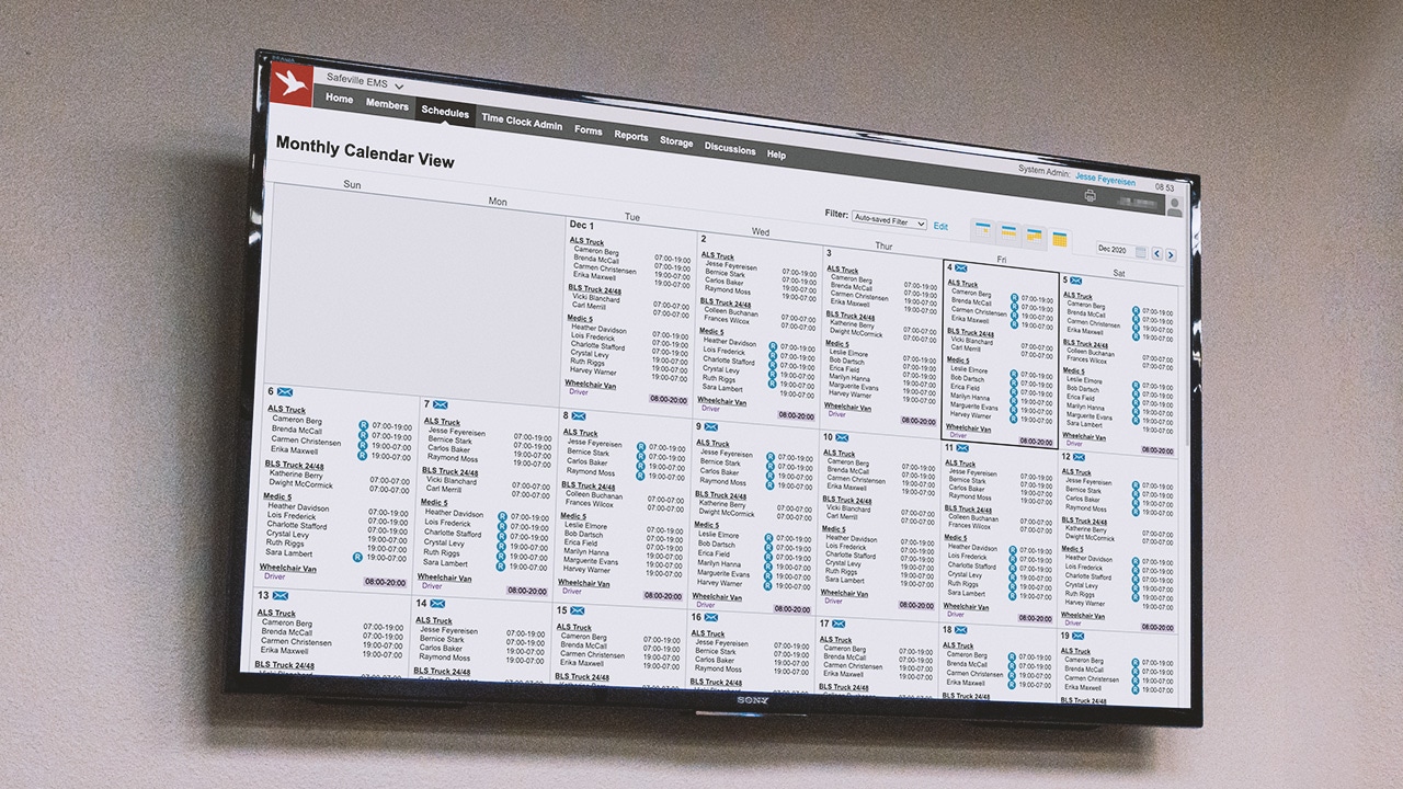 Department schedules on a large screen via Aladtec software